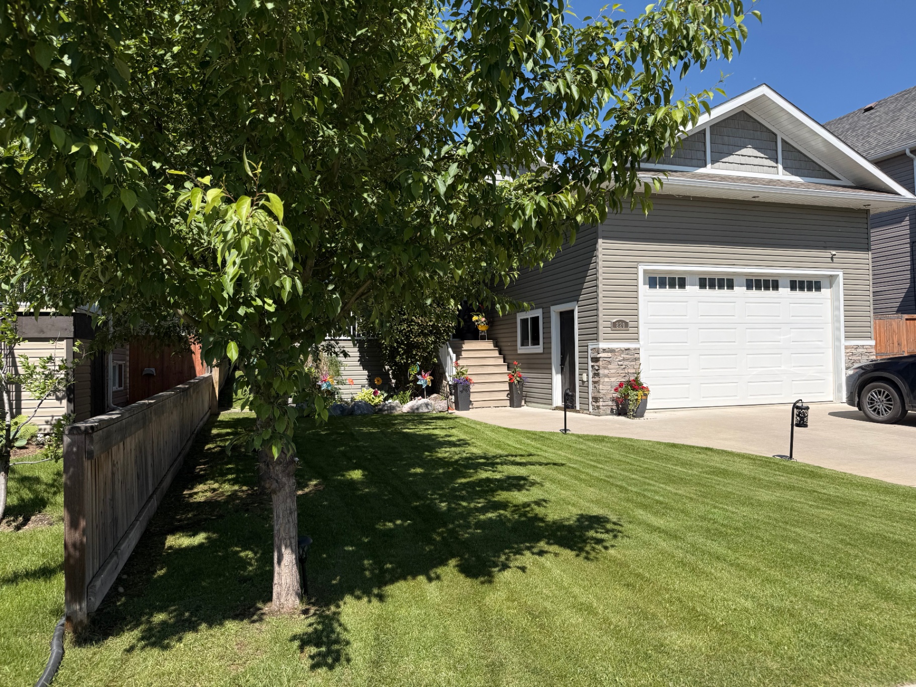 Freshly mowed front lawn with crisp stripes in Slave Lake